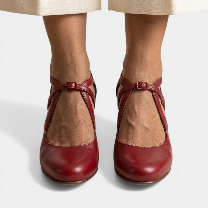 Sophisticated women's T-Strap dress heels with a sleek silhouette and secure buckle.