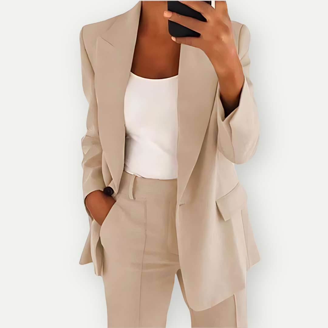 Elegant women's tailored blazer and pants set, perfect for versatile office attire & professional business chic.