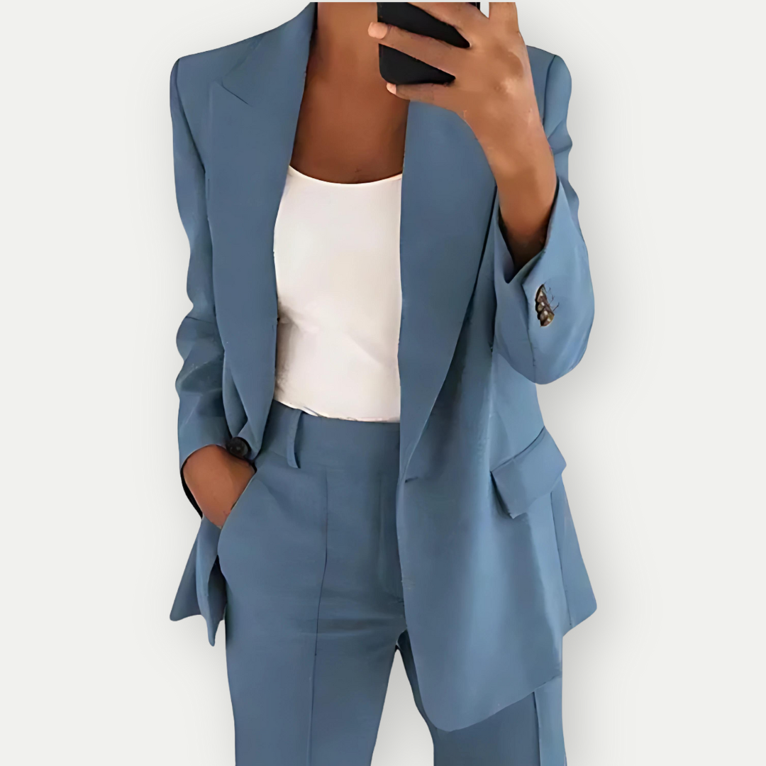 Modern women's tailored blazer and pant set. A chic professional outfit for office or special events.