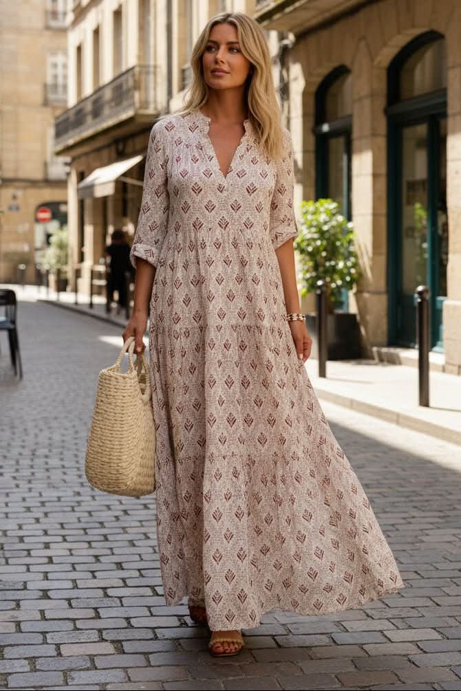 Pink elegant tiered maxi dress for women, flowy and chic, ideal for summer parties or special occasions.