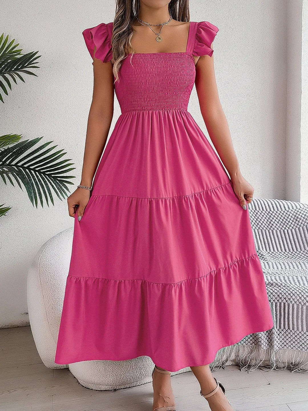 Versatile women's tiered midi dress, effortlessly transitioning from casual chic to elegant occasion wear.