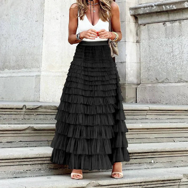 Sophisticated women's occasion wear maxi skirt, featuring elegant tiers & ruffles for special events.