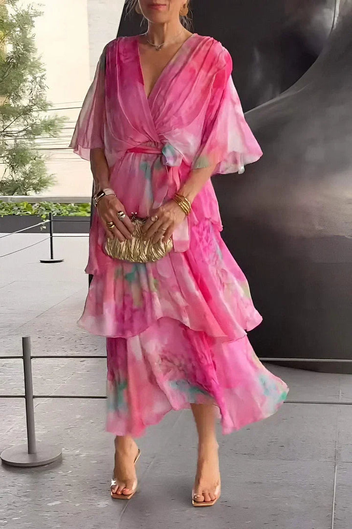 Chic women's party dress: a flowy tiered wrap design for elegant summer evenings and special occasions.