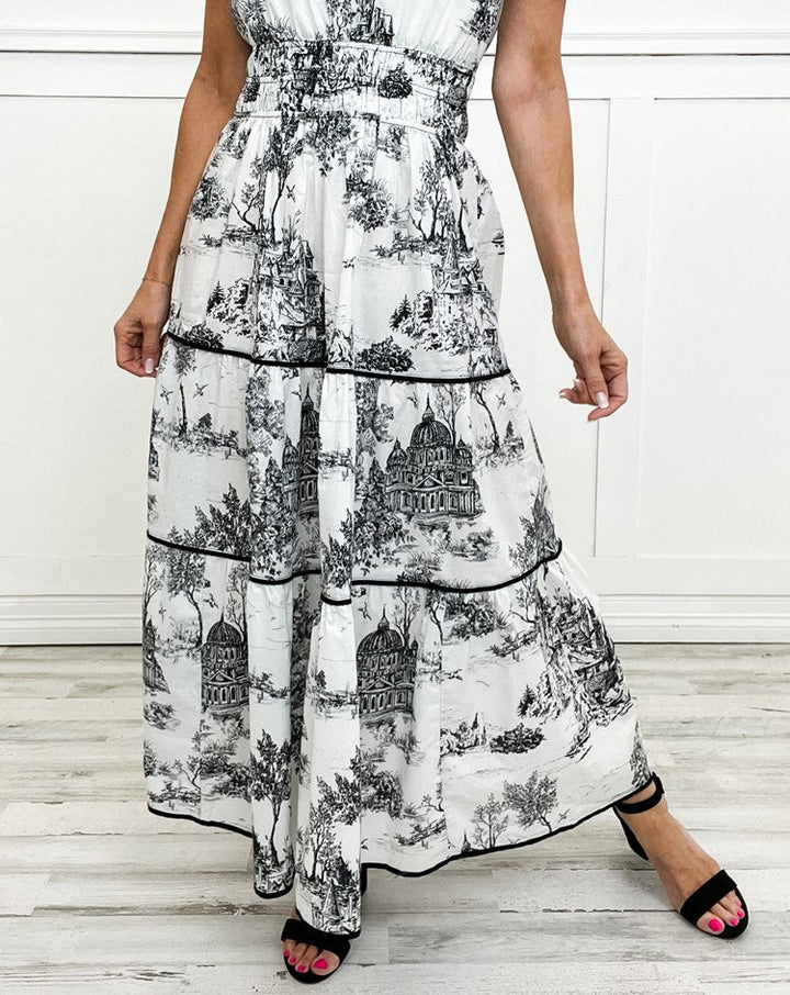Detail of smocked waist on women's elegant toile print maxi dress, comfortable & stylish.