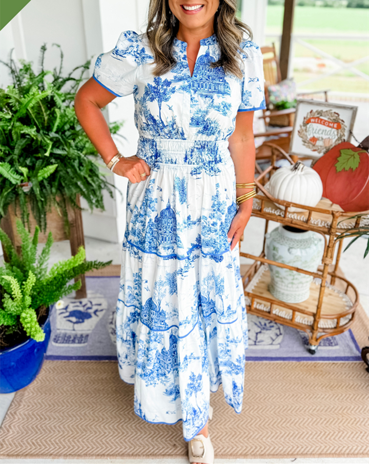 Stylish toile print maxi dress for women, featuring a smocked waist and tiered skirt.