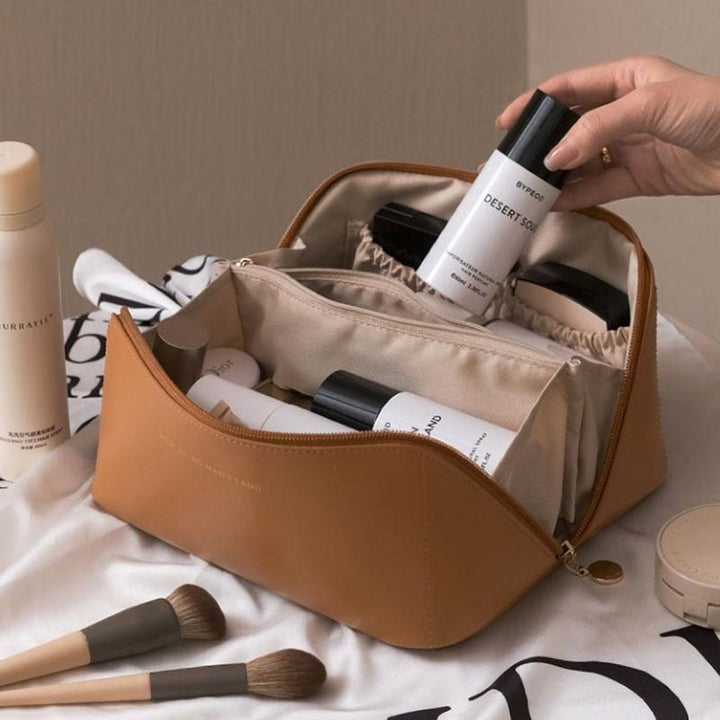 Premium women's travel makeup bag, designed for elegant cosmetic organization & easy portability.