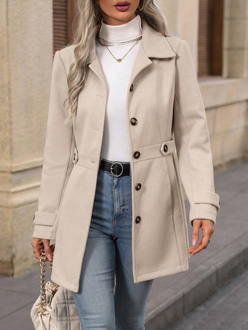 Versatile women's trench coat with adjustable belt, essential fall fashion outerwear for an elegant classic style.