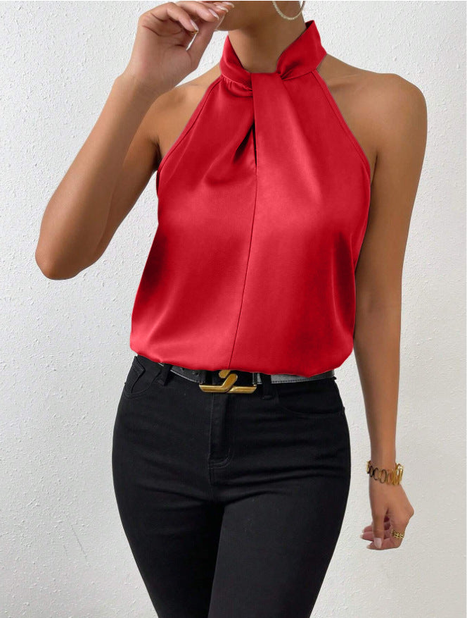 Model styled elegantly in the twist knot short sleeve top with a skirt for a dressy look.