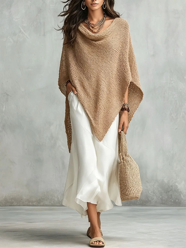 Stylish woman in elegant two-piece poncho maxi dress set. Relaxed, versatile, and comfortable for all occasions.