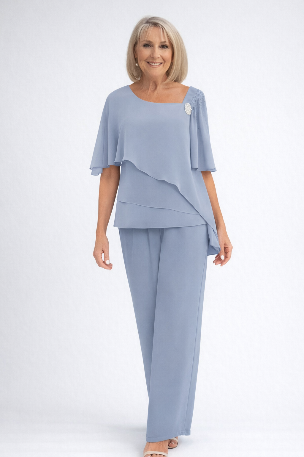 Elegant women's two-piece set featuring a tiered cape top and wide-leg trousers, perfect for formal occasions.