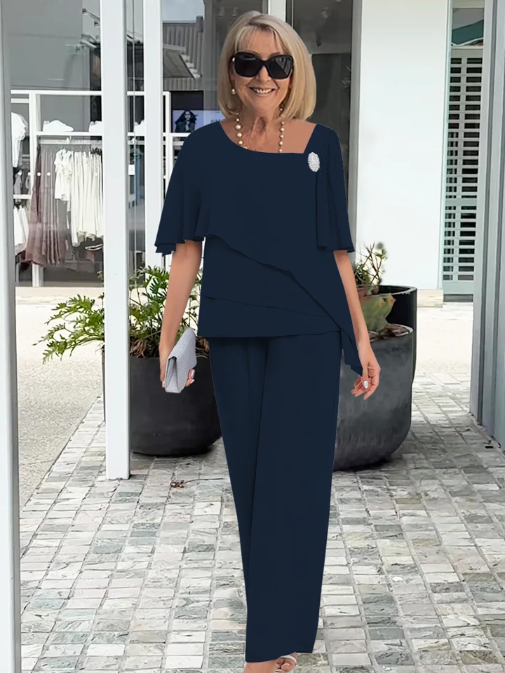 Stylish women's elegant two-piece set: tiered cape top with wide-leg pants for a sophisticated look.