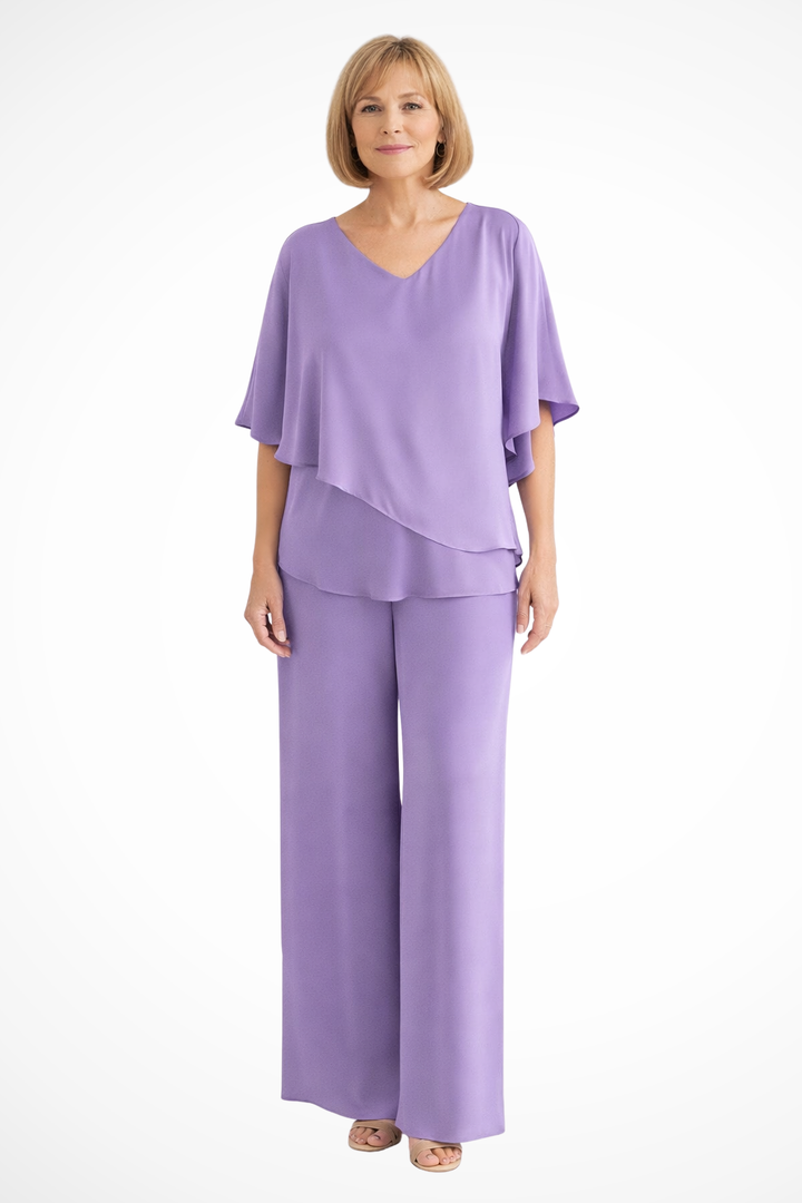 Elegant women's two-piece set. V-neck top, batwing sleeve, and wide-leg trousers. Perfect for travel outfits.