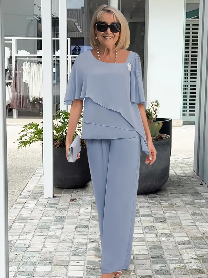 Elegant women's two-piece set featuring an overlay top & straight-leg pants. Perfect for chic, sophisticated wear.