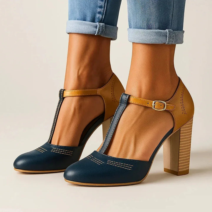 Chic women's blue & white two-tone block heel pumps, offering comfort for work or casual outings.
