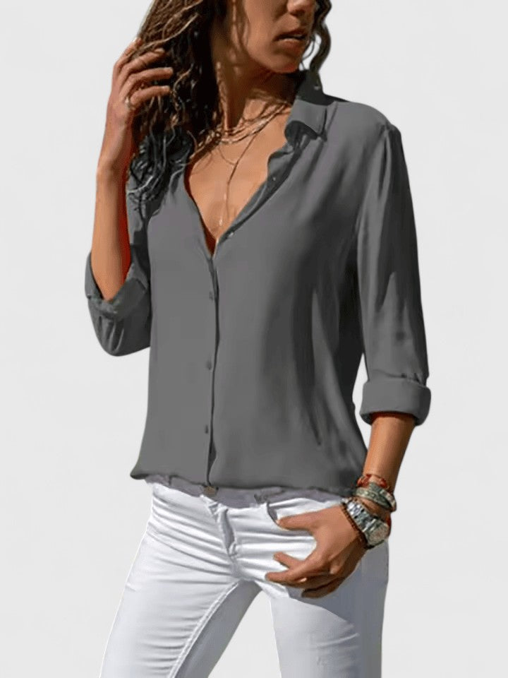 Flowy V-neck blouse for women. Elegant top with a relaxed fit, ideal for summer fashion and office chic.