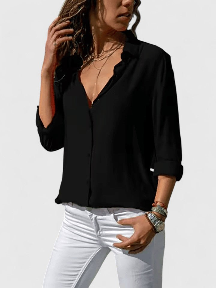 Chic women's V-neck blouse. Versatile long sleeve top with a flowy, relaxed fit for professional or casual outfits.
