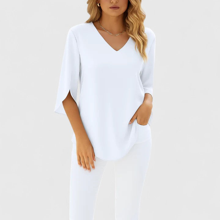 V-neck women's blouse. Elegant split sleeve top, perfect for a sophisticated summer or warm weather look.