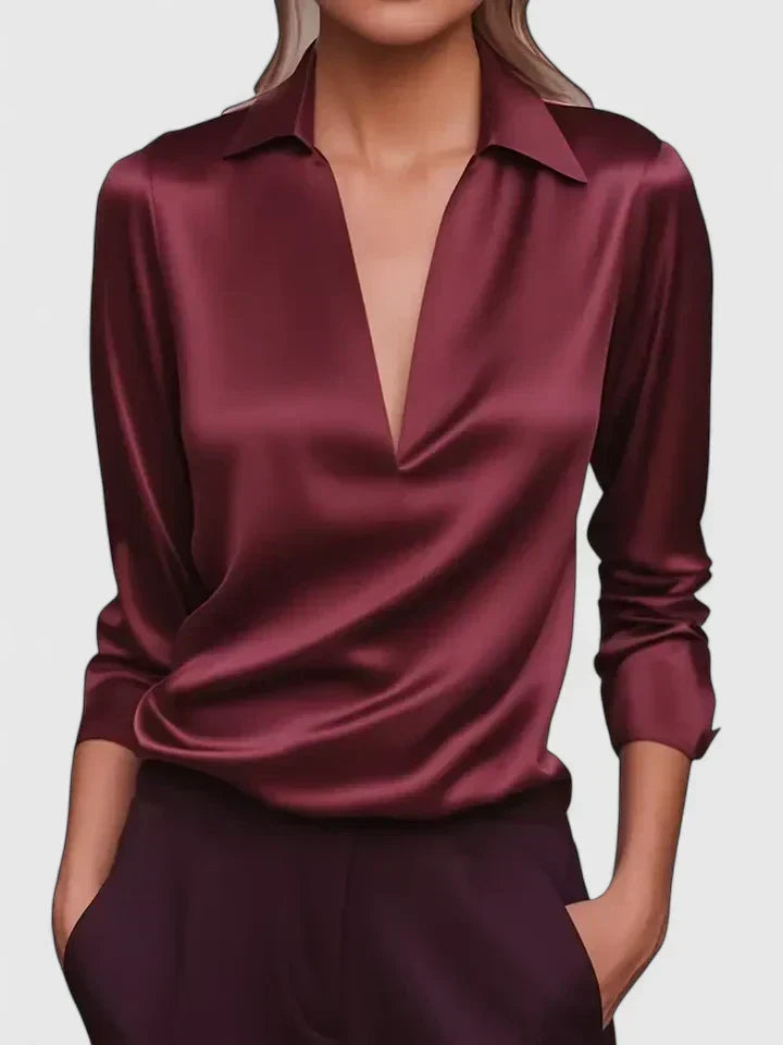 Sophisticated women's shiny V-neck blouse, draped for a relaxed fit. Ideal formal top for evening wear & office.