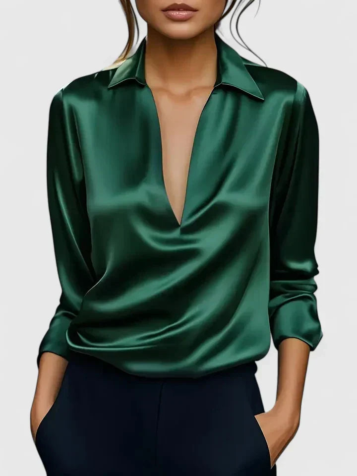 Luxurious shiny women's V-neck blouse with elegant draping & long sleeves. Relaxed fit for sophisticated wear.