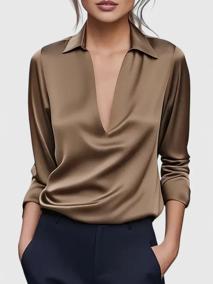 Chic women's shiny V-neck blouse with elegant draping & relaxed fit. A versatile formal top for evening or office.