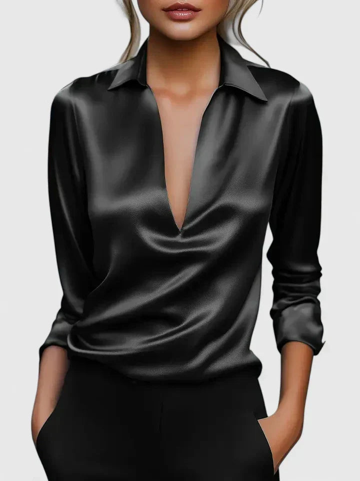 Women's fashionable V-neck blouse, draped and long-sleeved, featuring a luxurious shiny finish. Effortless elegance.