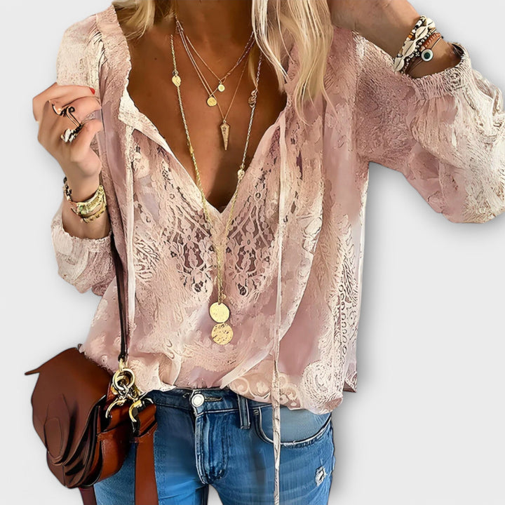 Feminine pink V-neck long sleeve lace blouse for women. Elegant and versatile top, perfect for chic office or date night.