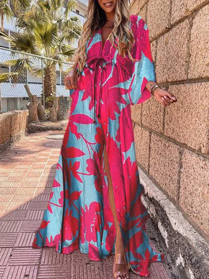 Women's elegant maxi dress showcasing V-neckline, wide kimono sleeves, and a captivating high slit.