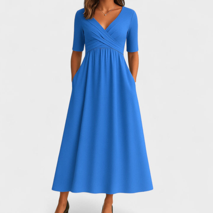 Modern women's elegant midi dress. Deep V-neck & crossover waist offer a chic, comfortable, and versatile fashion statement.
