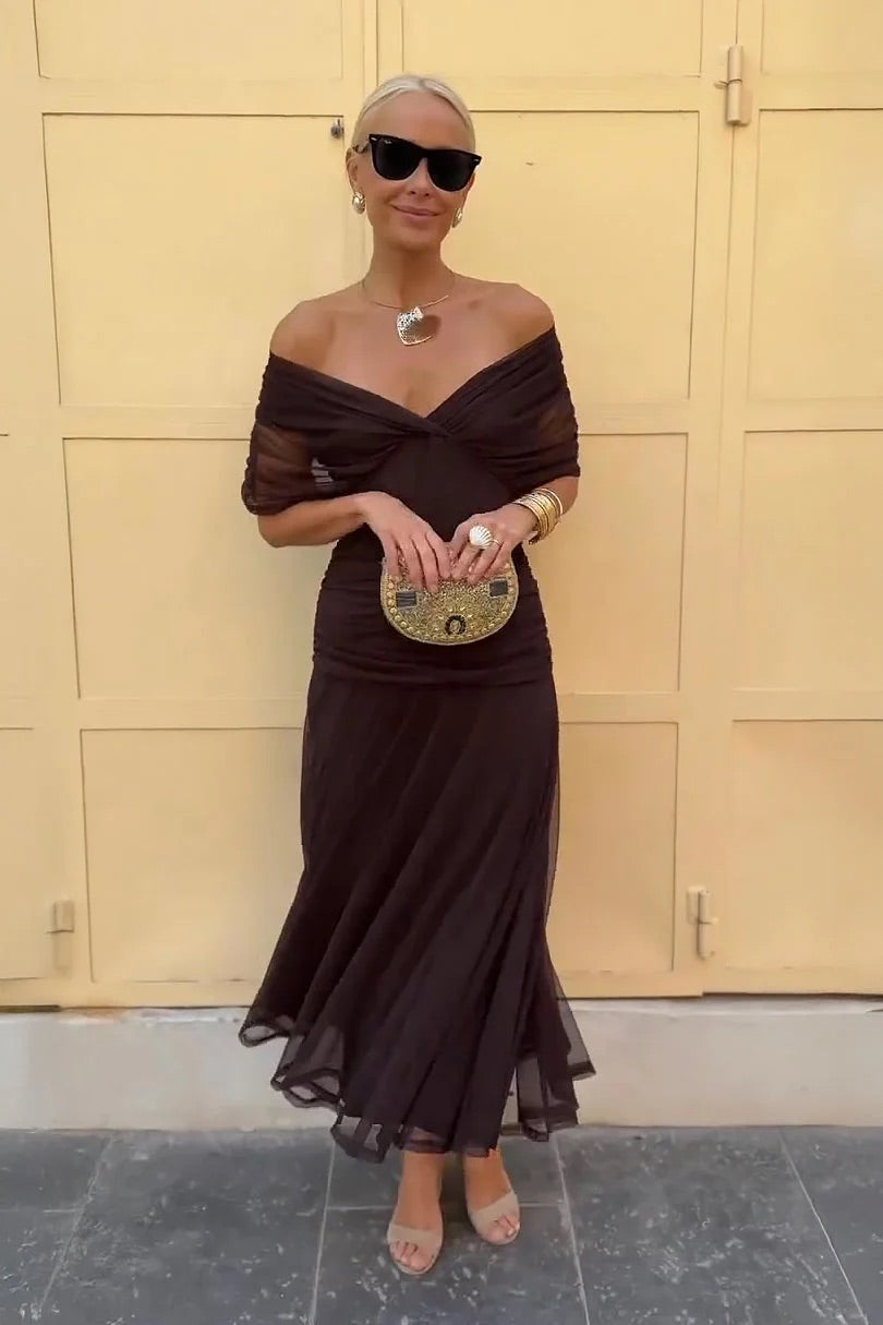 Women's elegant V-neck midi dress with flutter sleeves, ideal as a wedding guest or party dress.