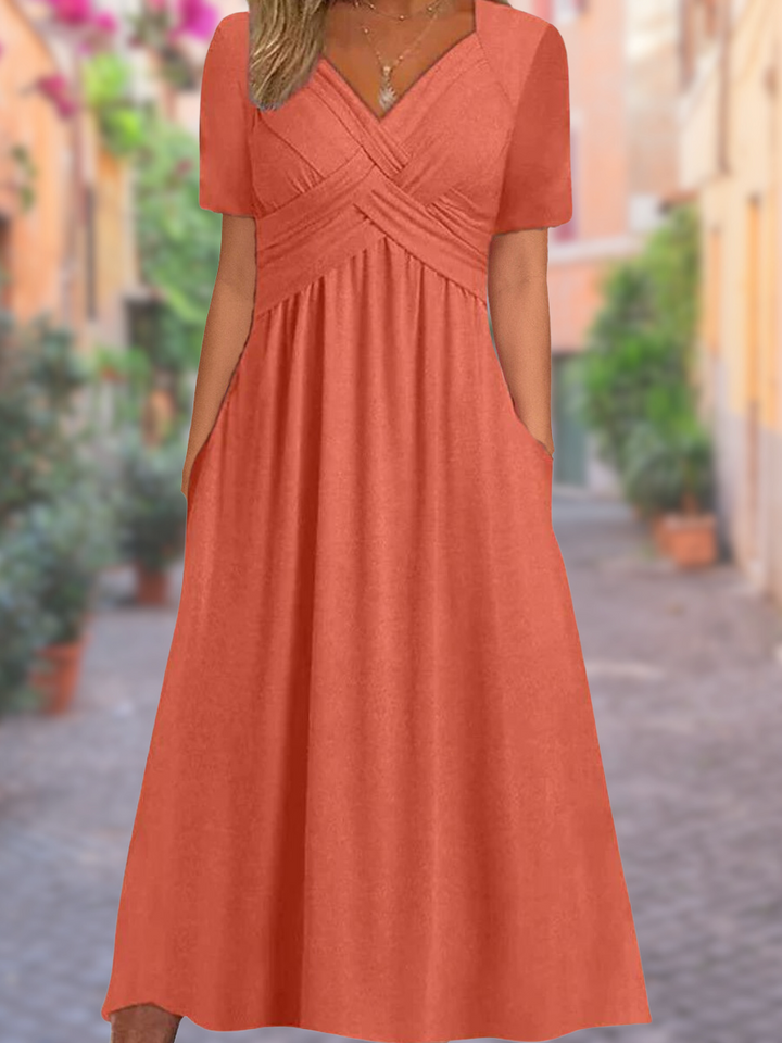 Elegant women's V-neck midi dress with stylish crisscross bodice, perfect for versatile spring/summer wear.