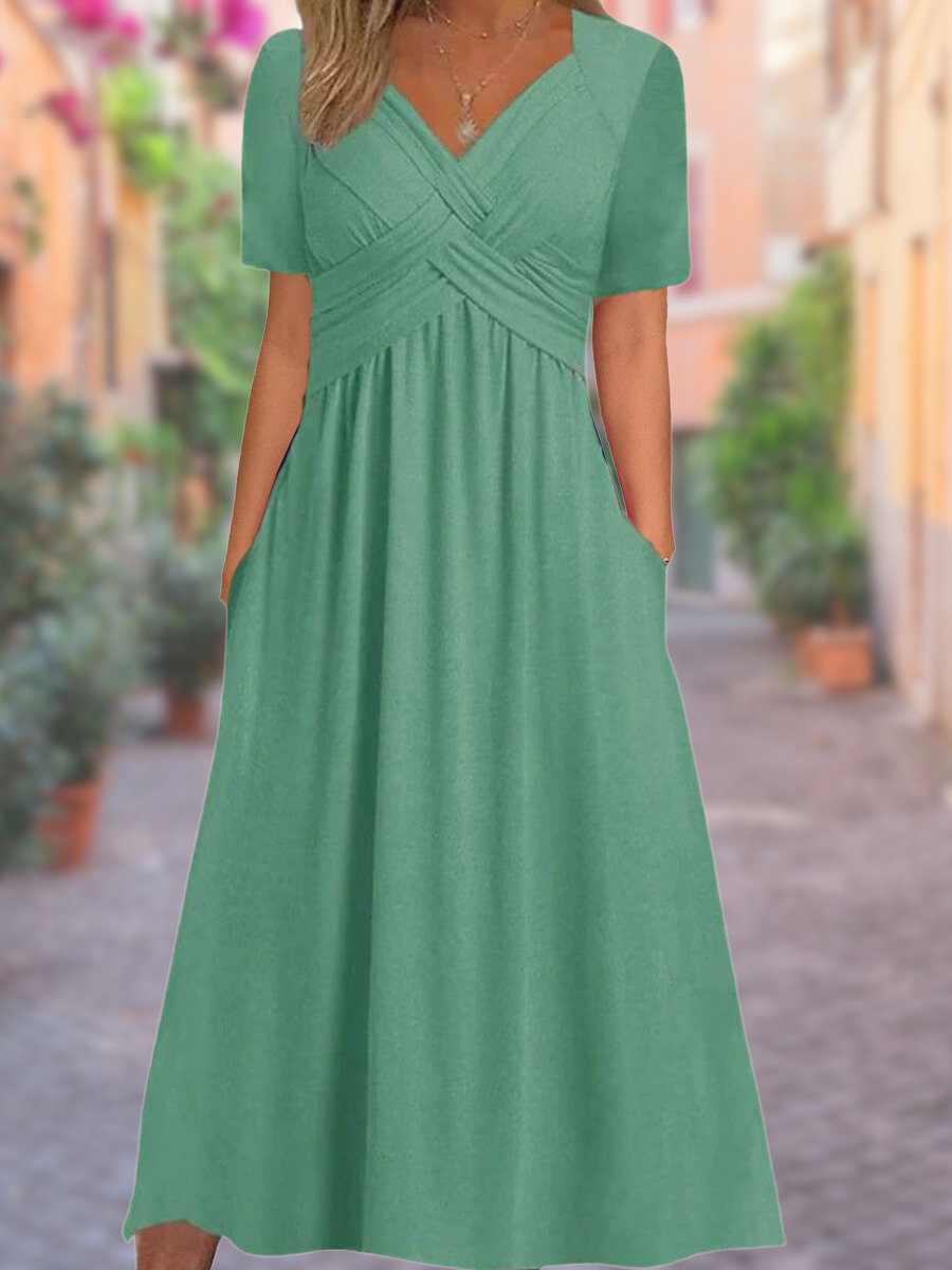 Comfortable women's midi dress featuring a flattering V-neckline and chic crisscross bodice detail.