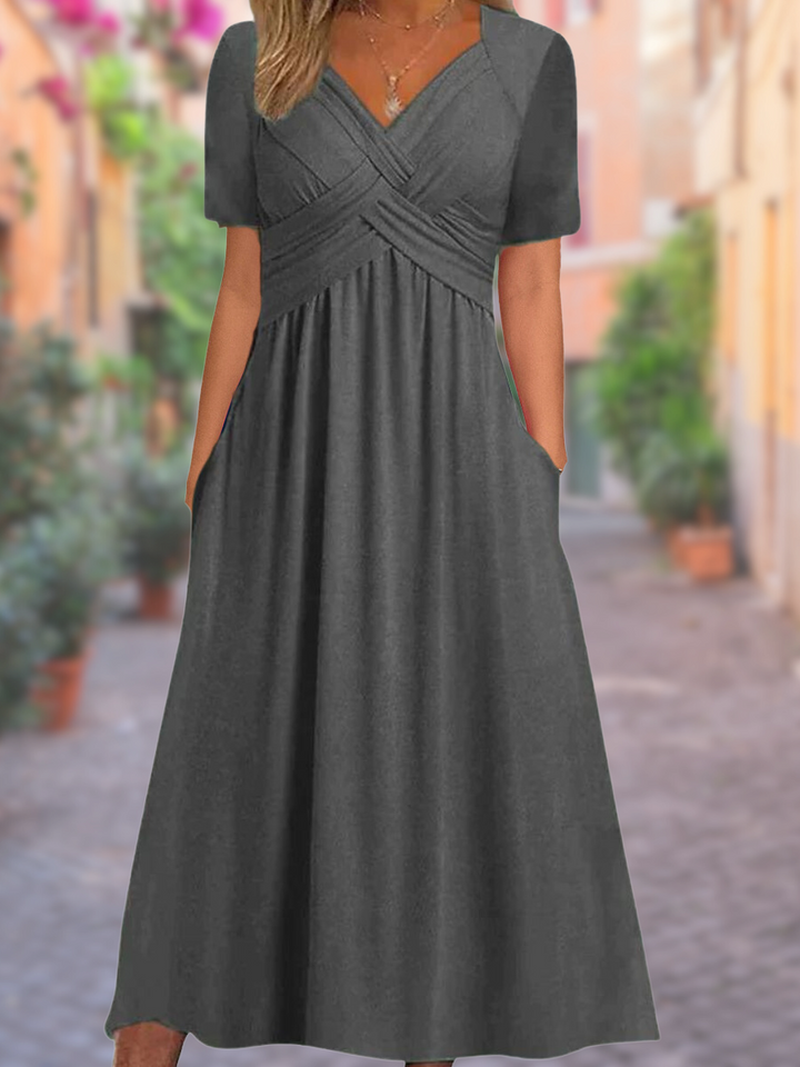 Versatile V-neck midi dress for women, with an elegant crisscross bodice, suitable for day or evening wear.