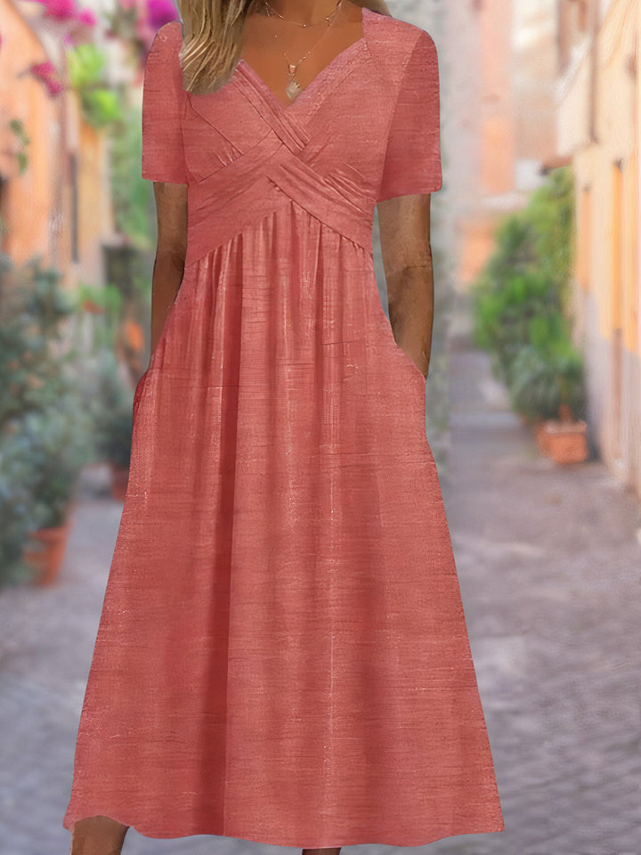 Stylish women's V-neck midi dress with unique crisscross bodice, ideal for elegant spring and summer fashion.