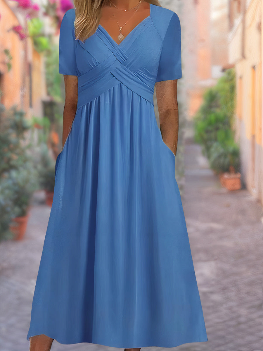 Sophisticated women's midi dress showcasing a V-neck and crisscross bodice, blending elegance with comfort.