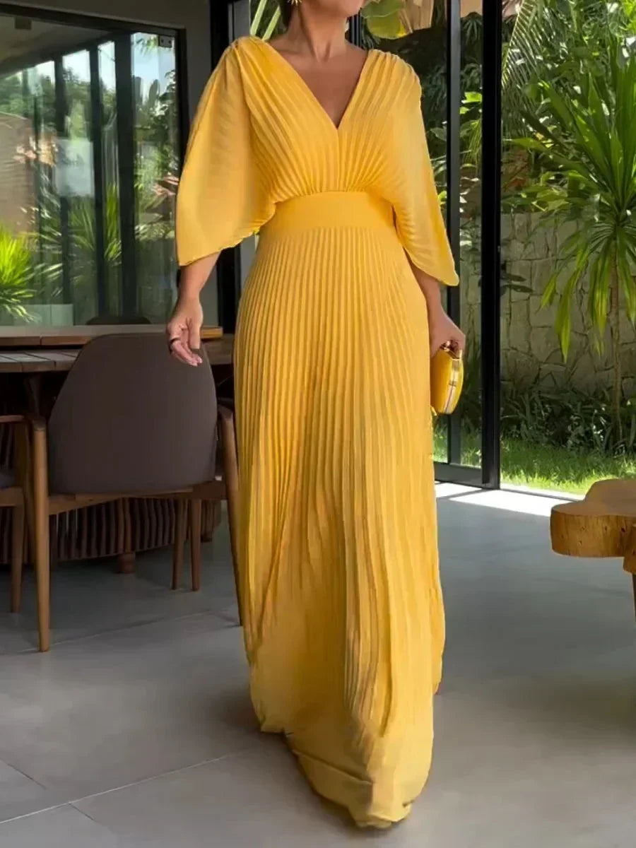 Elegant women's V-neck pleated flowy kaftan maxi dress. Perfect for summer, vacation, and comfortable occasion wear.