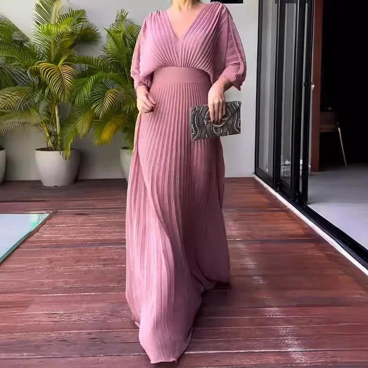 Sophisticated V-neck pleated flowy kaftan maxi dress for women. Ideal elegant summer, vacation, and occasion fashion.
