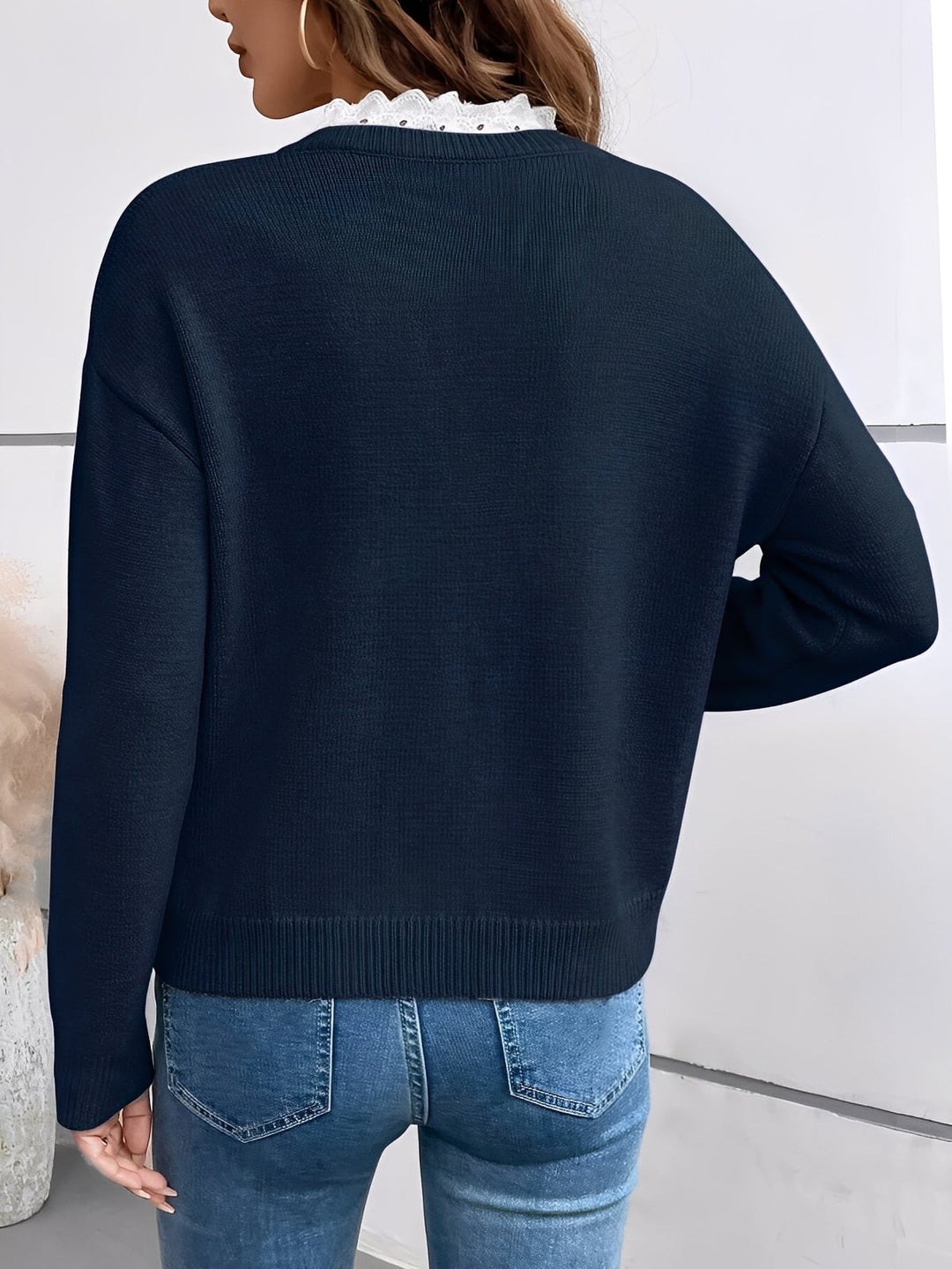Stylish & comfortable women's v-neck pullover sweater with lace trim. Versatile long sleeve top for everyday fashion.