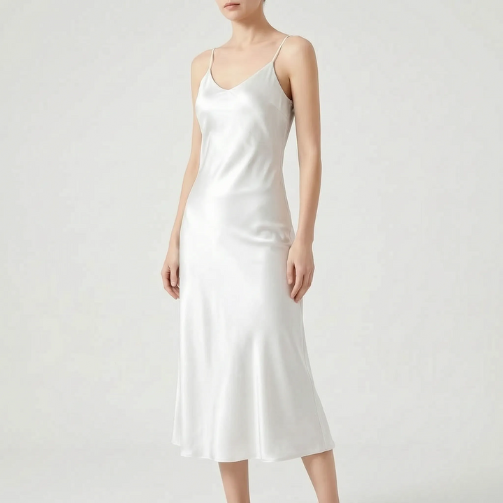 Chic women's V-neck slip midi dress, offering an elegant A-line silhouette for parties or casual wear.