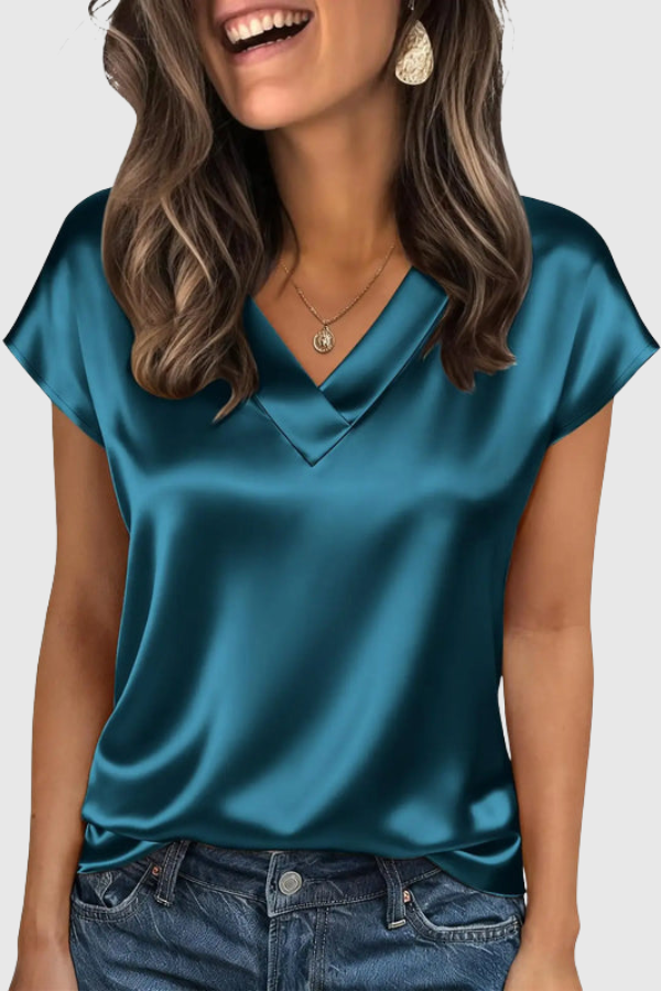 Women's V-neck vacation blouse, airy loose fit short sleeve top, essential for summer travel comfort.
