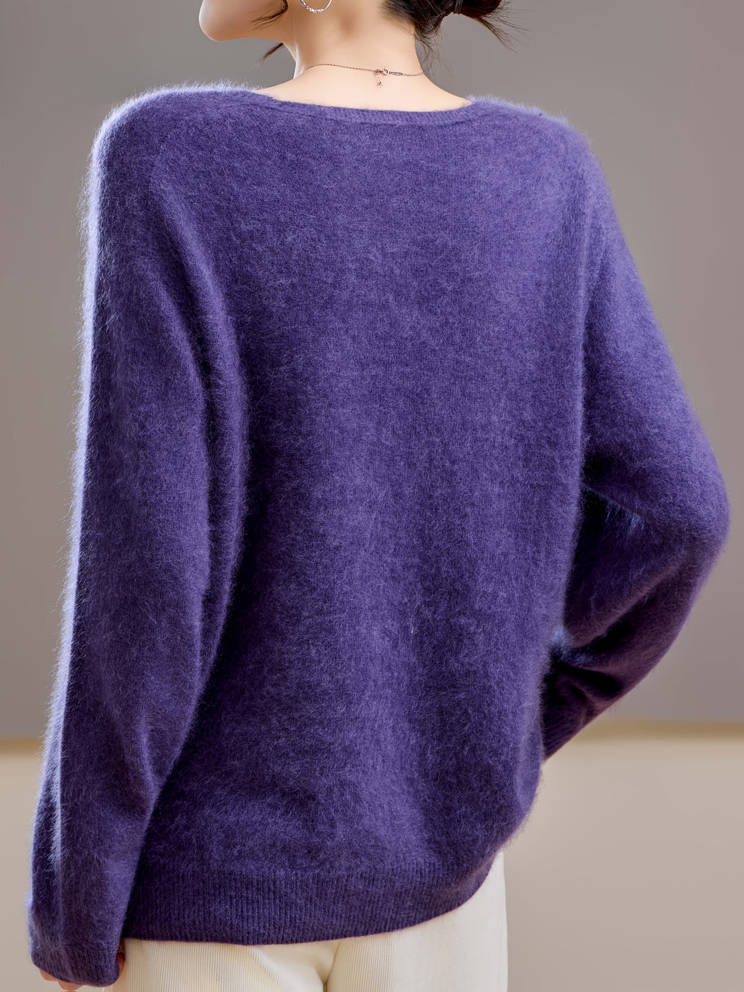 Stylish women's V-neck knitwear, a relaxed fit long sleeve top for elegant casual wear.