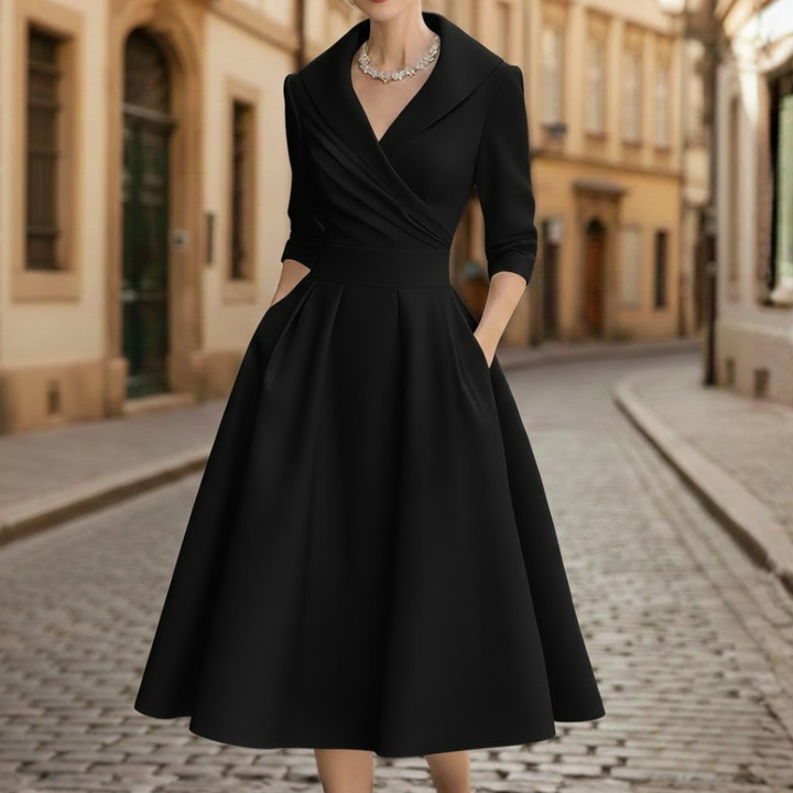 Sophisticated women's V-neck midi dress with three-quarter sleeves, flared skirt, and pockets for elegant comfort.