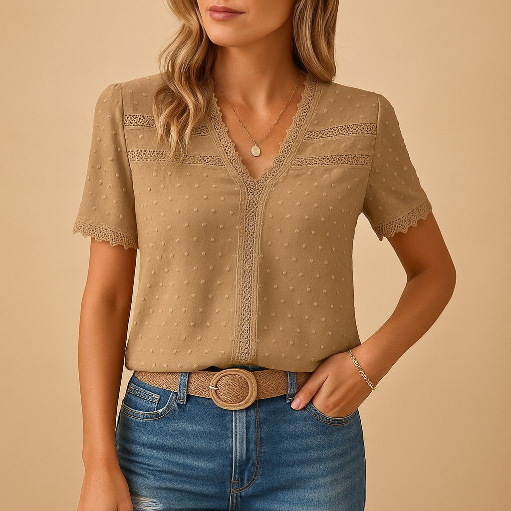 Elegant women's V-neck top with delicate lace trim and Swiss dot texture, perfect for casual spring and summer fashion.