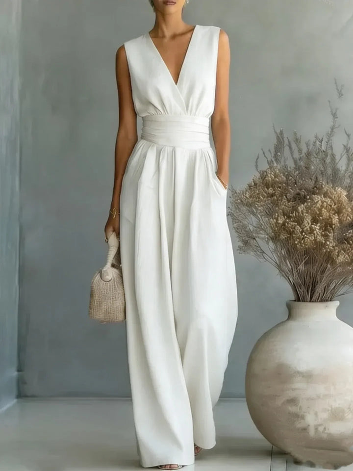 Flowy women's sleeveless V-neck wide-leg jumpsuit, perfect for elegant yet casual summer style and comfort.