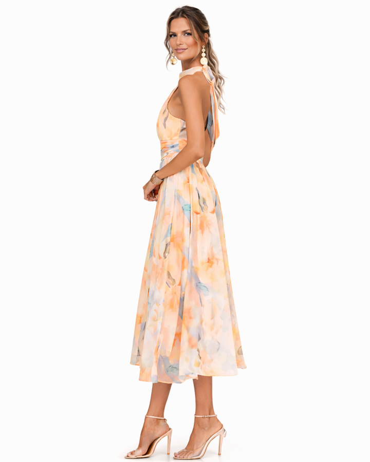 Vibrant watercolor print women's halter maxi dress, soft flowing fabric, ideal for comfortable vacation wear.