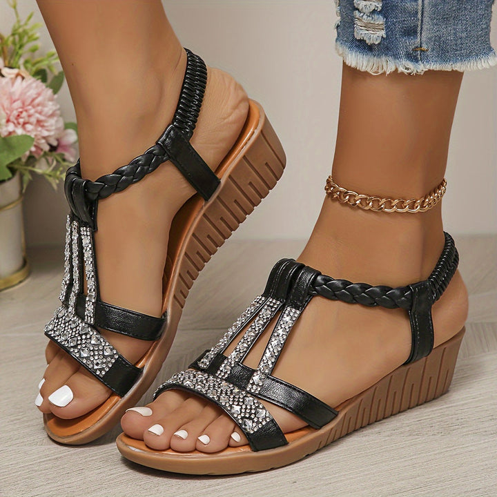 Woman wearing elegant wedge sandals, demonstrating comfortable & stylish summer fashion.