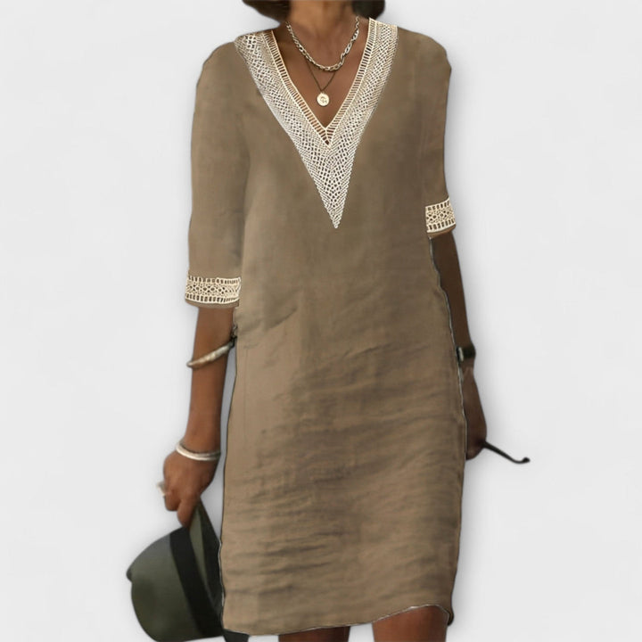 Versatile women's elegant crochet dress with beautiful openwork design & flowy silhouette, ideal for summer or resort.