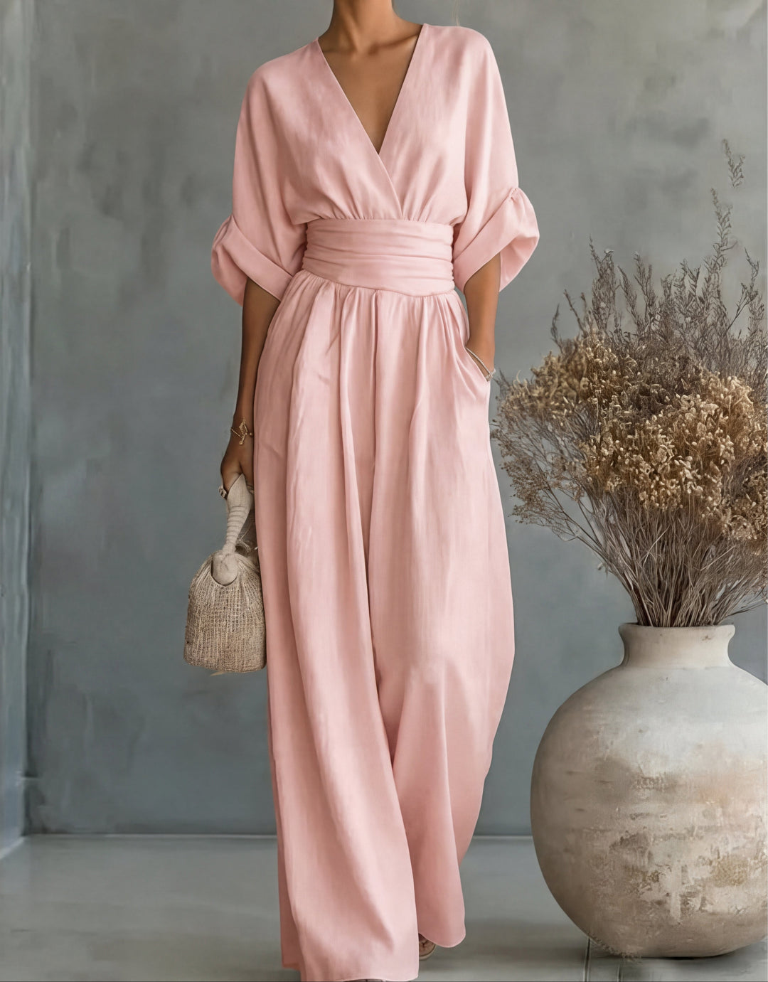 Comfortable wide-leg jumpsuit for women, elegant wrap front. Chic day to night style.