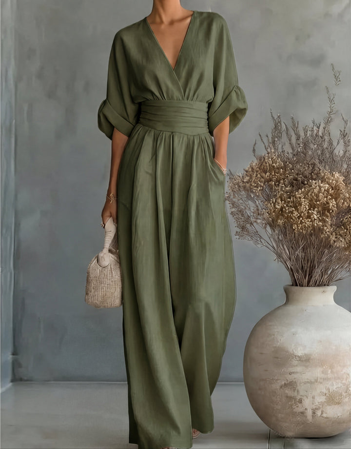 Women's wrap front wide-leg jumpsuit, flattering & elegant. Versatile for summer fashion.