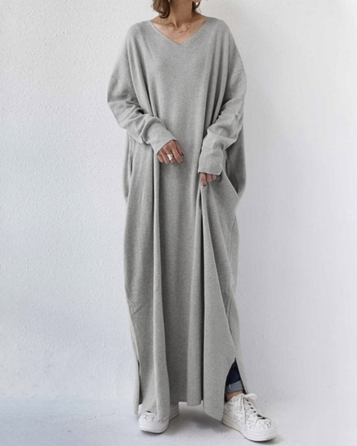 Elegant women's winter maxi dress with long sleeves and flowy design, perfect for cold weather fashion.