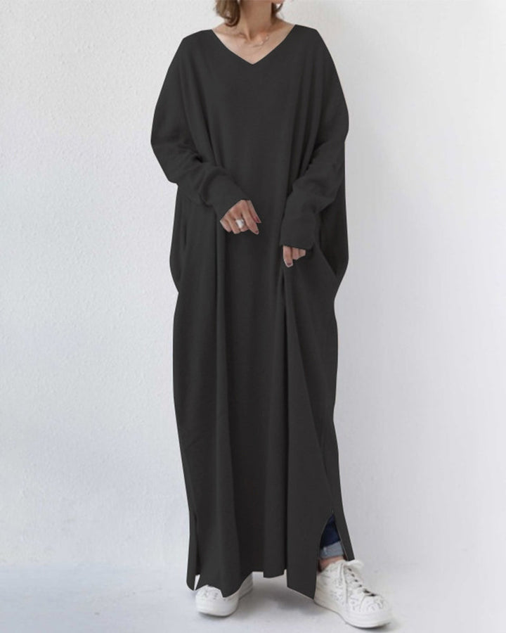 Grey women's long sleeve maxi dress, flowing and elegant, ideal for winter casual or evening wear.